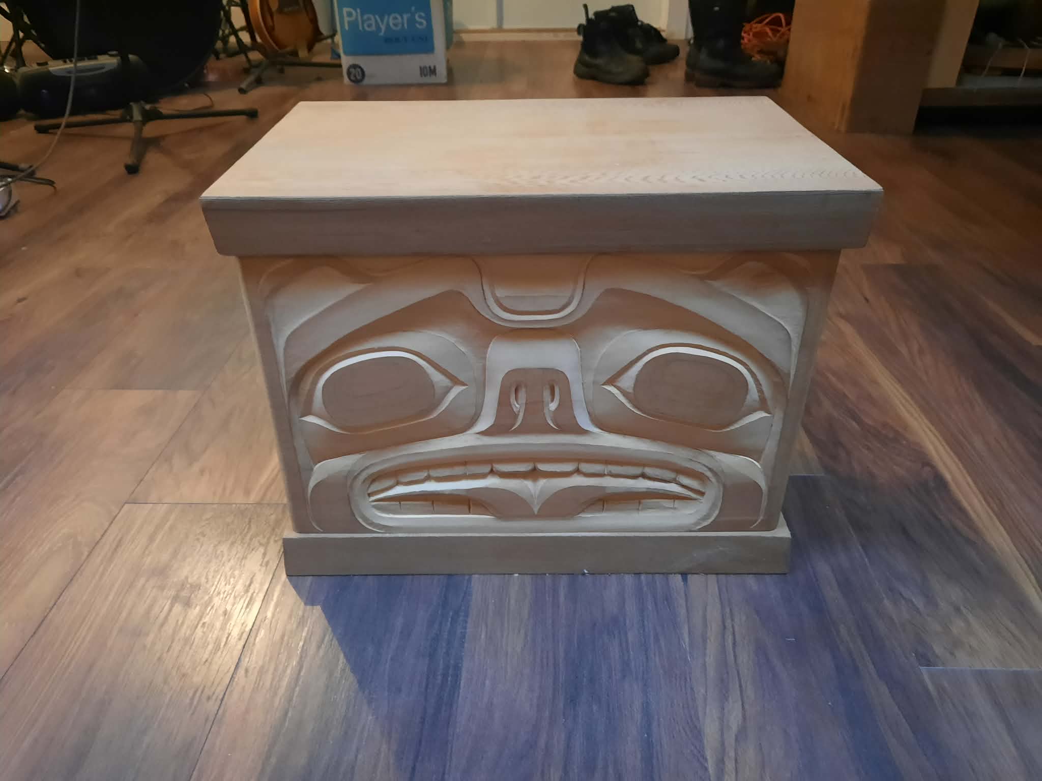 Bentwood box with carved face design